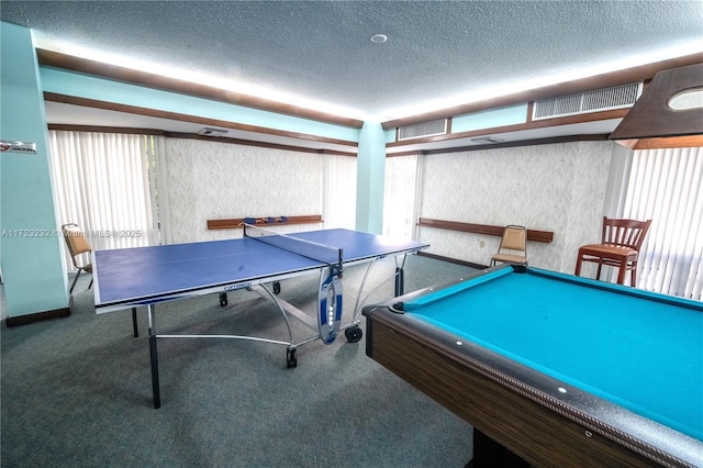 rec room featuring carpet, a textured ceiling, and pool table