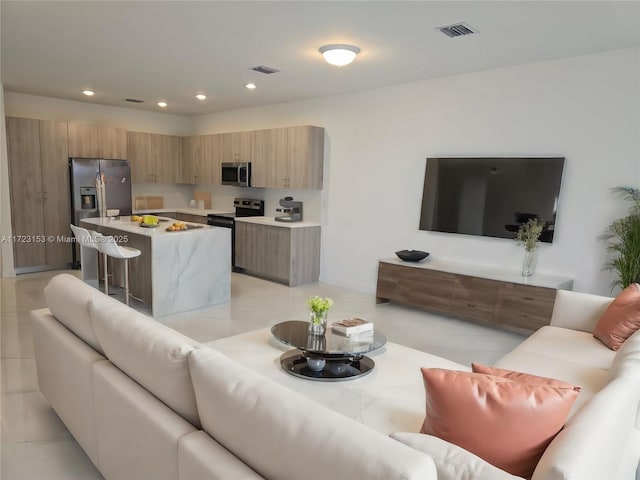 living room with light tile patterned floors