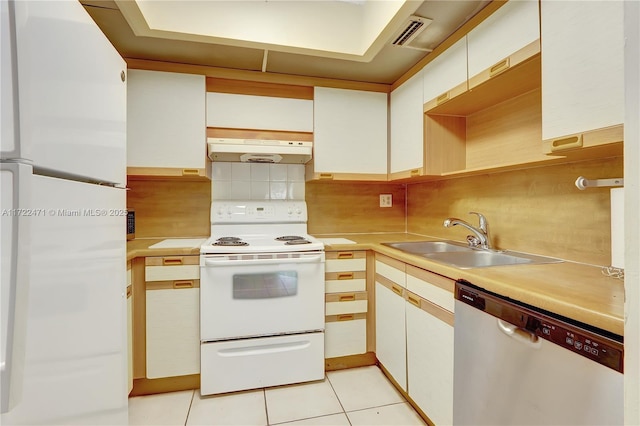 8860 SW 123rd Ct Unit K207, Miami, FL 33186 - kitchen with light countertops, under cabinet range hood, a sink, and white appliances