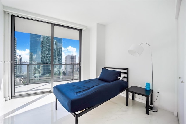 bedroom featuring floor to ceiling windows