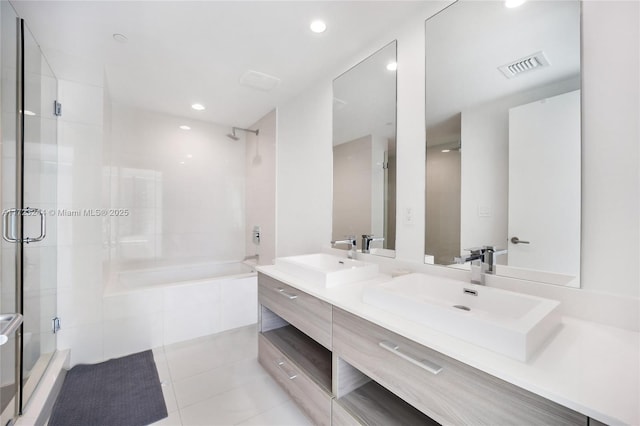 bathroom with tile patterned flooring, vanity, and independent shower and bath