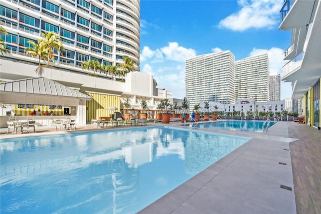 view of swimming pool featuring a patio area