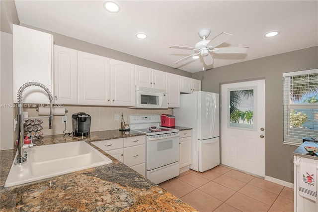 kitchen with white cabinetry, sink, ceiling fan, white appliances, and light tile patterned floors