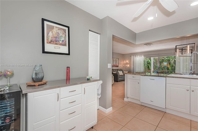 400 NE 14th Ave Unit 214, Hallandale Beach, FL 33009 - kitchen with light tile patterned floors, a sink, white cabinets, dishwasher, and pendant lighting