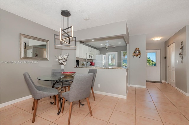 400 NE 14th Ave Unit 214, Hallandale Beach, FL 33009 - dining area with recessed lighting, a textured ceiling, baseboards, and light tile patterned floors