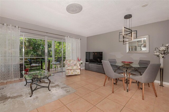 living room with light tile patterned floors and a textured ceiling