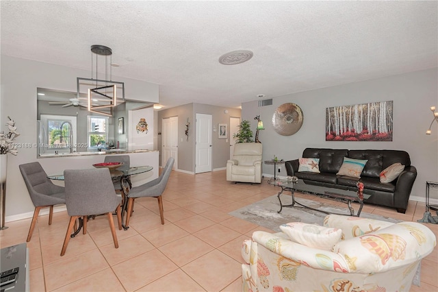 400 NE 14th Ave Unit 214, Hallandale Beach, FL 33009 - living area featuring a textured ceiling, light tile patterned flooring, visible vents, and baseboards