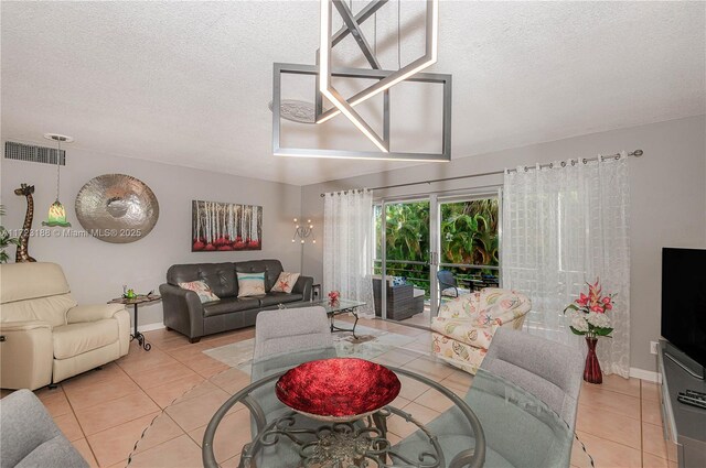 living room with light tile patterned floors and a textured ceiling