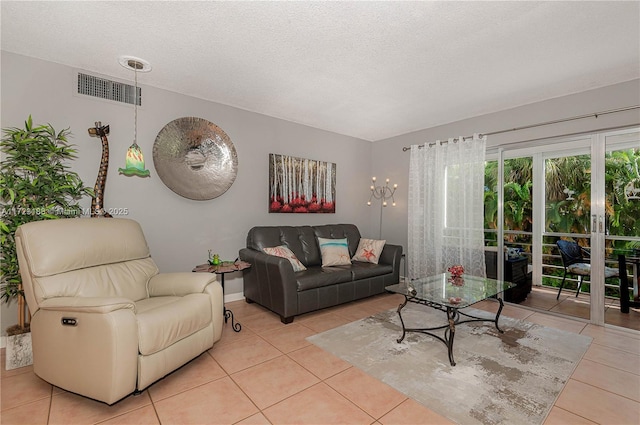 400 NE 14th Ave Unit 214, Hallandale Beach, FL 33009 - living area with visible vents, a textured ceiling, and light tile patterned floors