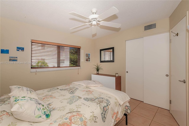 400 NE 14th Ave Unit 214, Hallandale Beach, FL 33009 - bedroom with light tile patterned floors, a textured ceiling, visible vents, and a closet