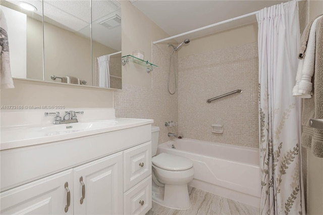 full bathroom featuring vanity, toilet, and shower / tub combo with curtain