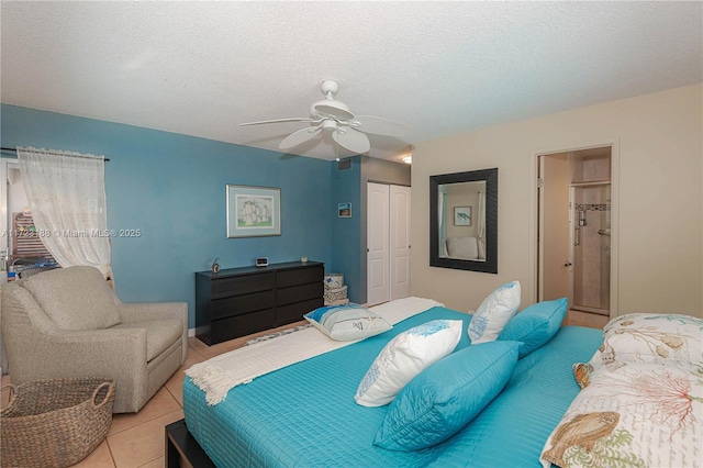 400 NE 14th Ave Unit 214, Hallandale Beach, FL 33009 - bedroom featuring light tile patterned floors, ceiling fan, a textured ceiling, and a closet