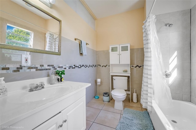 full bathroom featuring toilet, vanity, tile patterned flooring, tile walls, and shower / bath combination with curtain