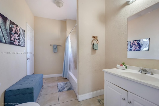 bathroom with shower / tub combo, tile patterned flooring, and vanity