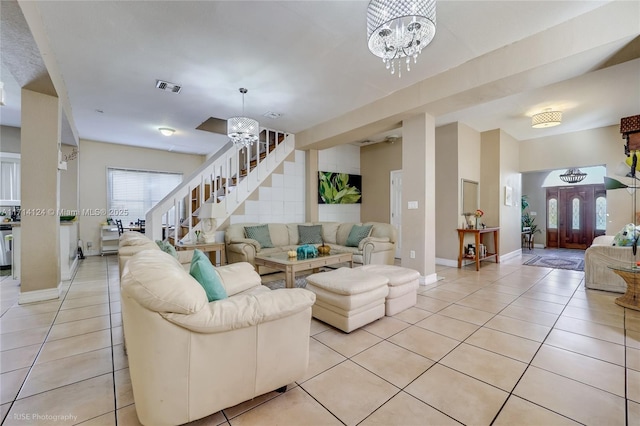 living room featuring light tile patterned floors and a chandelier