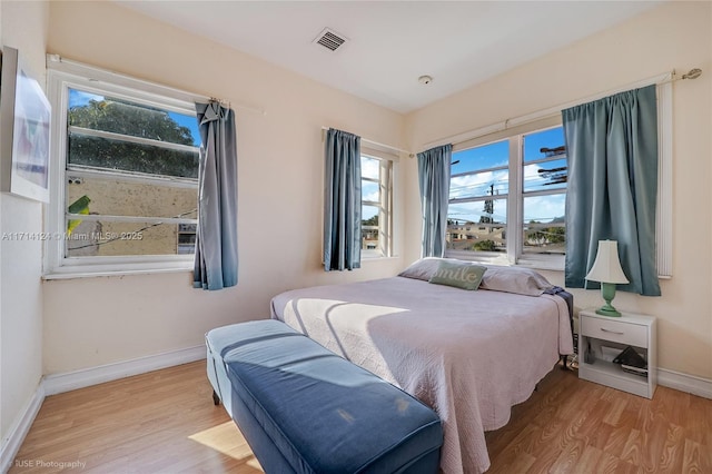 bedroom with light hardwood / wood-style flooring