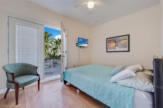 bedroom with light wood-type flooring, ceiling fan, and access to exterior