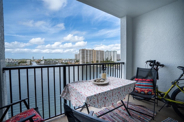 balcony featuring a water view