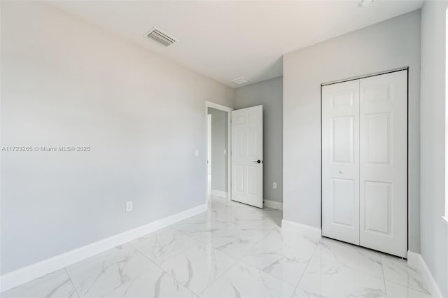 unfurnished bedroom featuring a closet