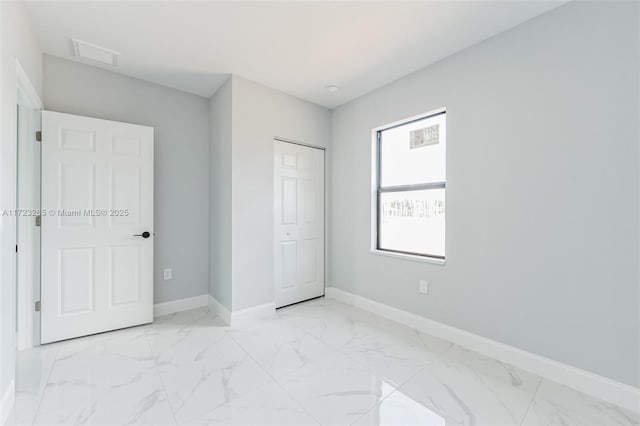 unfurnished bedroom featuring a closet