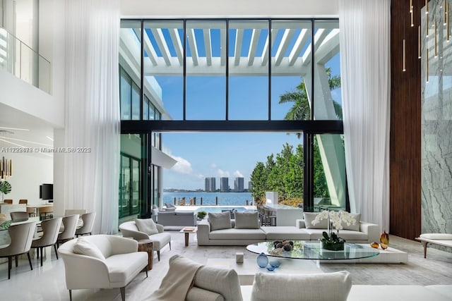 living room with a wealth of natural light and a water view