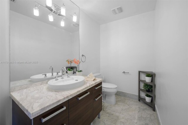 laundry room with stacked washer / dryer