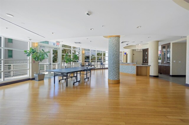 rec room with light hardwood / wood-style flooring and floor to ceiling windows