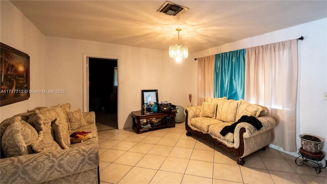 living room featuring light tile patterned floors and a notable chandelier