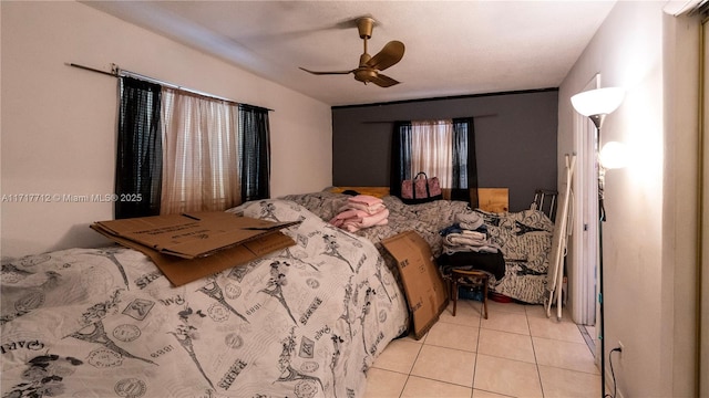 tiled bedroom with ceiling fan