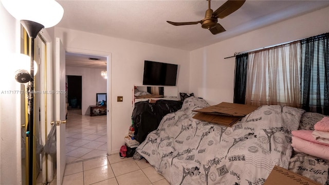 tiled bedroom with ceiling fan