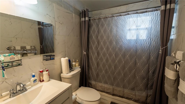 full bathroom featuring vanity, shower / tub combo, tile walls, and toilet