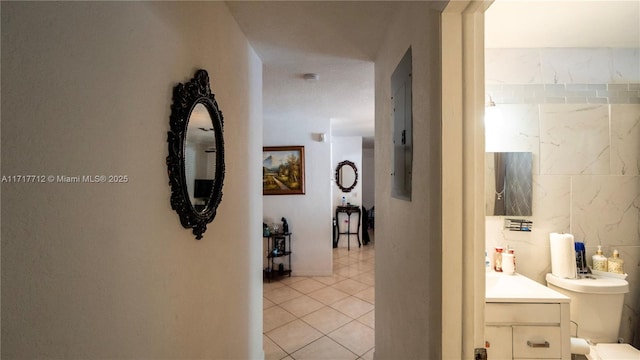 corridor with light tile patterned floors