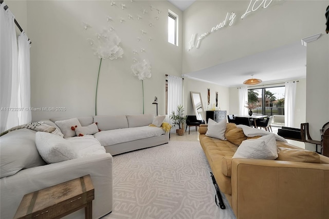 living room featuring a high ceiling