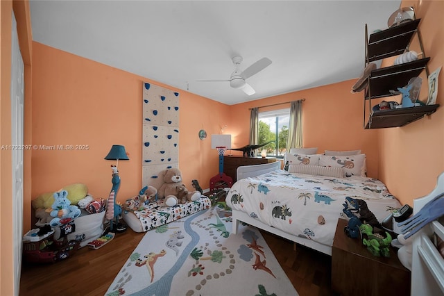 bedroom featuring ceiling fan and dark hardwood / wood-style flooring