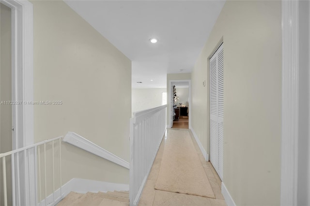 hall featuring light tile patterned flooring