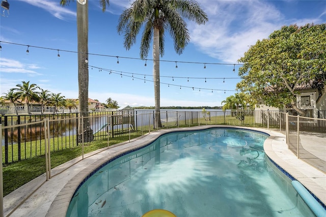 view of swimming pool featuring a water view