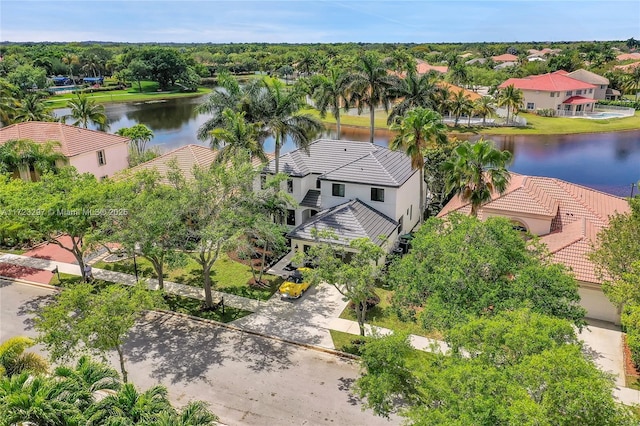 birds eye view of property with a water view