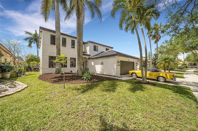 exterior space featuring a front lawn and a garage