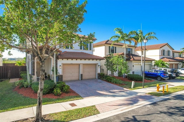 mediterranean / spanish house featuring a garage