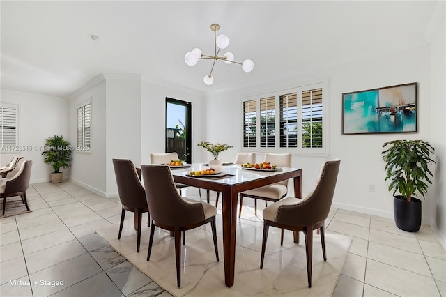 tiled dining space with an inviting chandelier and ornamental molding