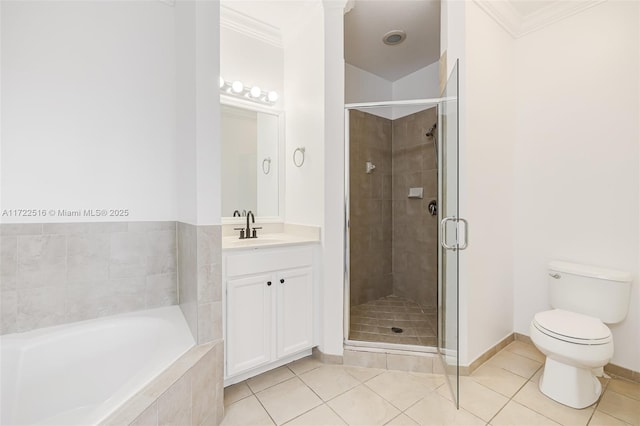 full bathroom featuring tile patterned floors, vanity, toilet, crown molding, and separate shower and tub