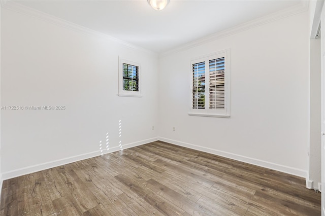 spare room with wood-type flooring and ornamental molding