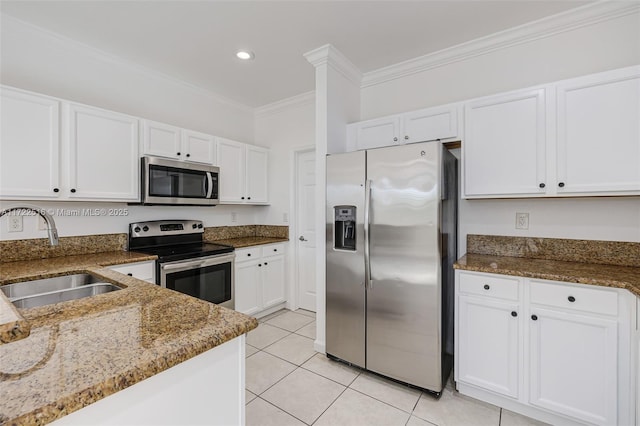 kitchen with sink, crown molding, white cabinets, and stainless steel appliances