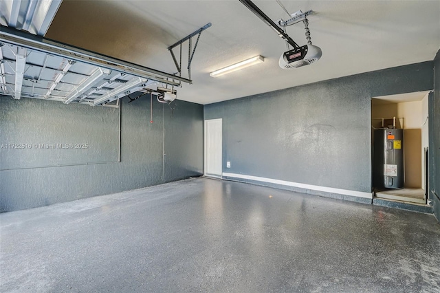 garage with a garage door opener and electric water heater