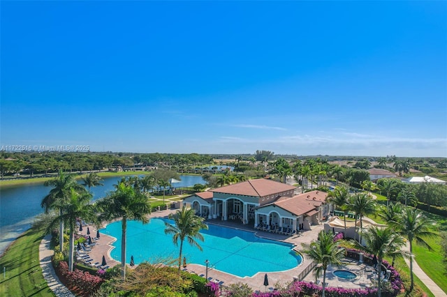 view of pool with a water view