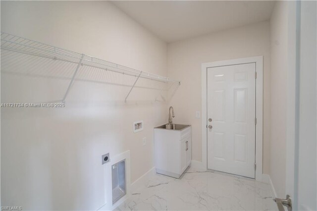 laundry area featuring hookup for a washing machine, electric dryer hookup, sink, and cabinets