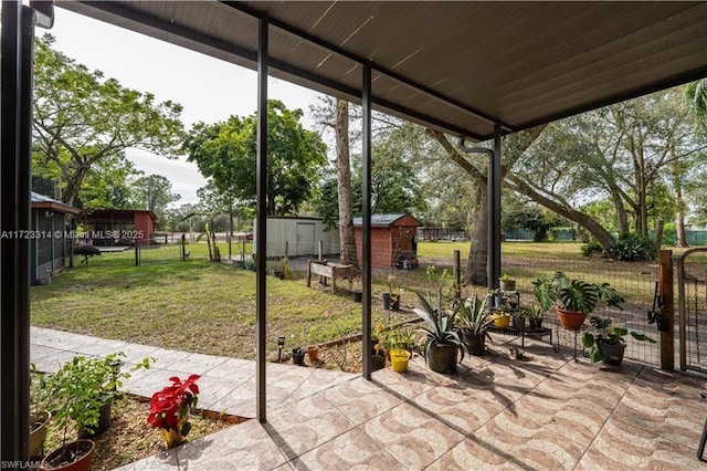 view of patio featuring a shed