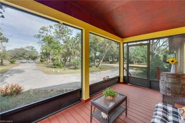 sunroom featuring vaulted ceiling