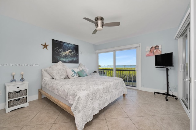 bedroom featuring ceiling fan, light tile patterned floors, and access to outside