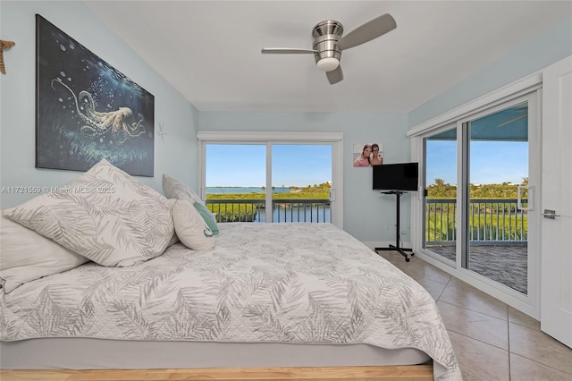 tiled bedroom featuring multiple windows, access to outside, and ceiling fan